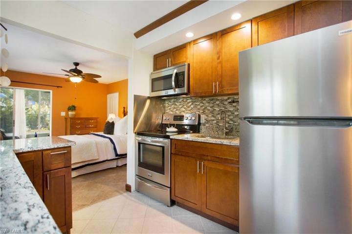 The Kitchen recently outfitted with brand new stainless steel appliances and features granite countertops, mosaic tile backsplash, maple shaker cabinetry and new fixturing!