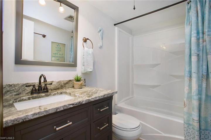 The Fully Renovated ensuite Bathroom features a granite top vanity, soaking tub & shower combo and oil rubbed bronze fixturing!