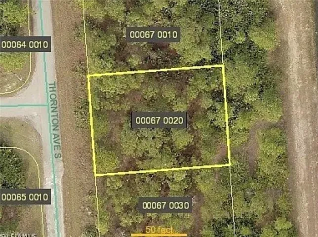 Aerial map of property and surrounding area featuring property boundaries highlighted