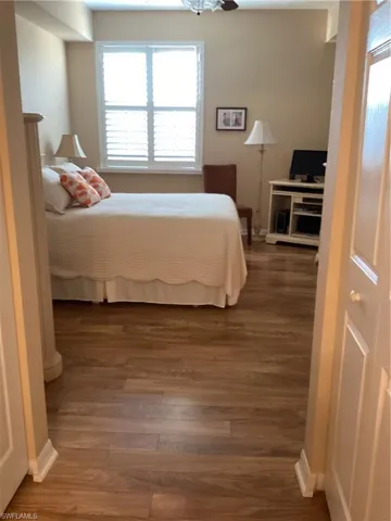 Bedroom with hardwood / wood-style floors