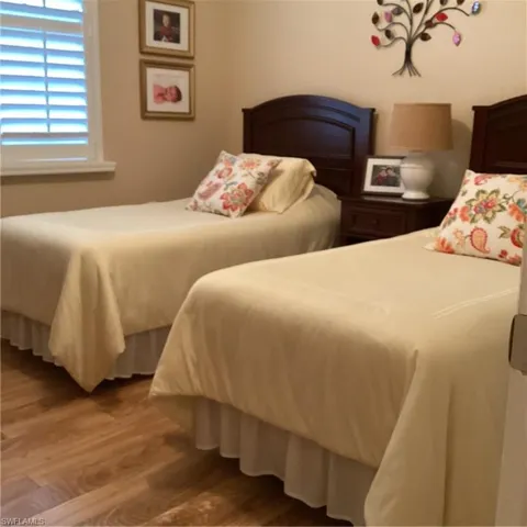 Bedroom with wood-type flooring
