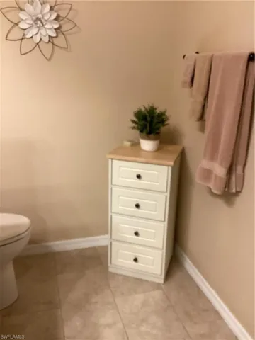 Bathroom with tile patterned floors and toilet