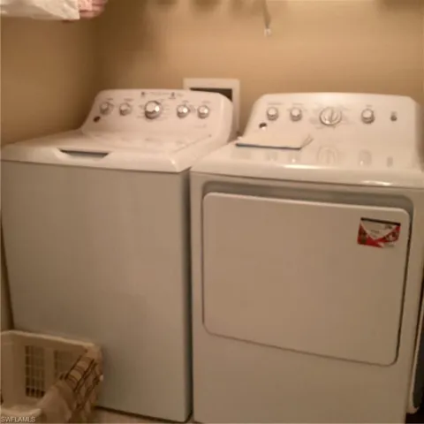 Laundry area with washing machine and clothes dryer