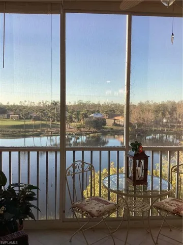 Unfurnished sunroom with a water view
