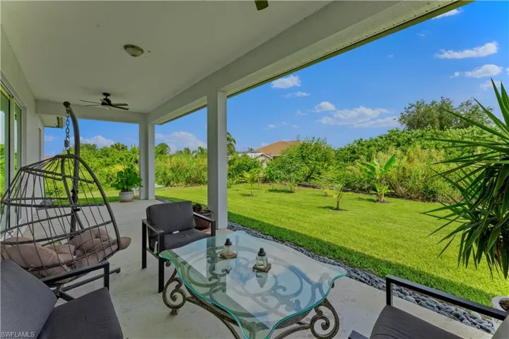 View of terrace with an outdoor living space and ceiling fan