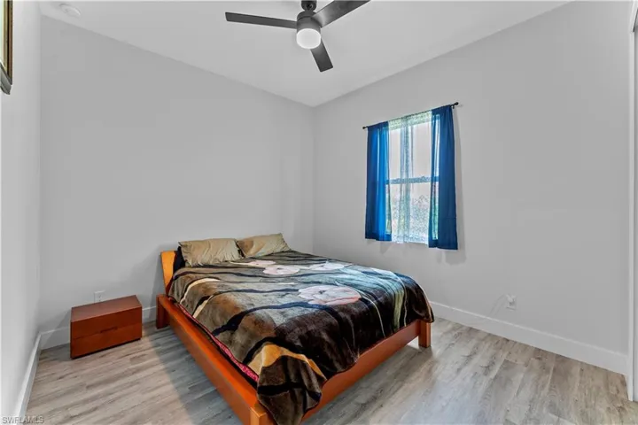 Bedroom featuring light wood-type flooring and ceiling fan