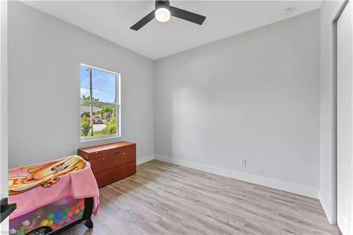 Bedroom with light wood-type flooring and ceiling fan