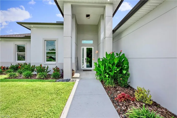 Property entrance featuring a lawn