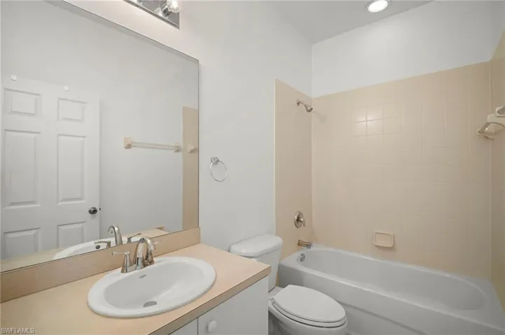 Full bath featuring vanity and shower / washtub combination