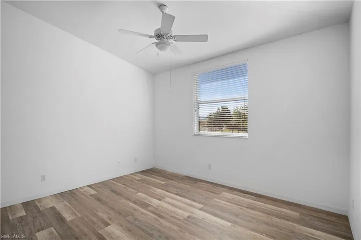 Spare room with light wood-style flooring and a ceiling fan