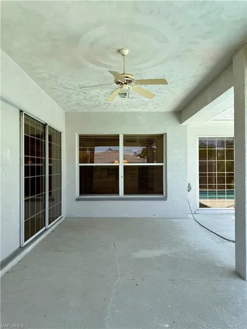 View of patio / terrace with ceiling fan.