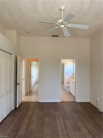 Unfurnished bedroom featuring light wood finished floors and a closet