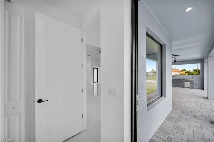 Corridor with light tile floors