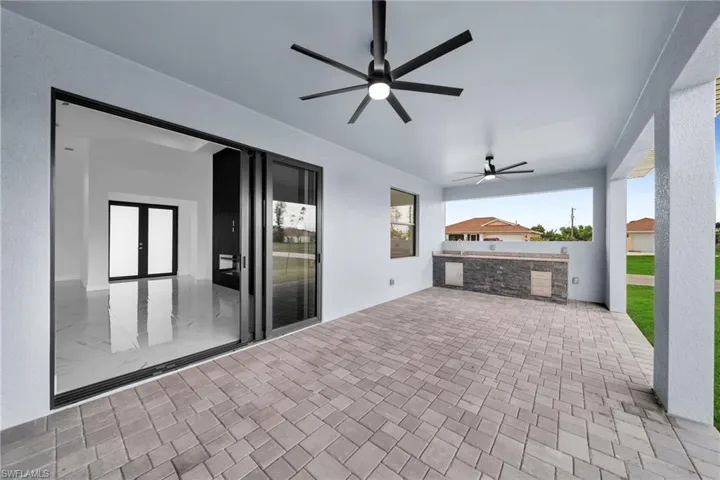 View of patio featuring ceiling fan