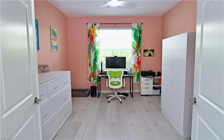 Office area featuring ceiling fan and light wood-type flooring