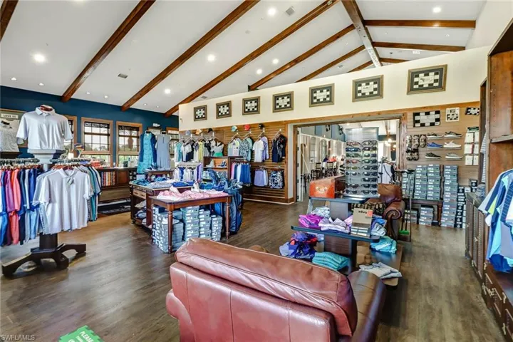 Living room with recessed lighting, visible vents, vaulted ceiling with beams, and wood finished floors
