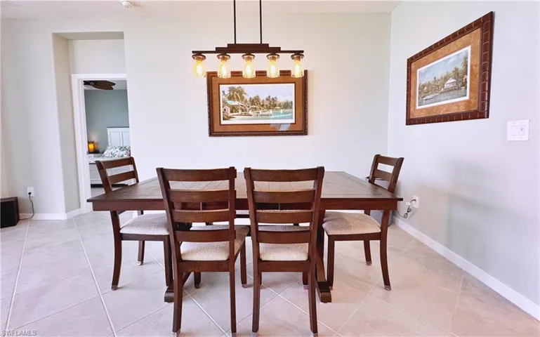 Dining room featuring light tile patterned flooring