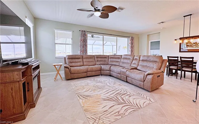 Tiled living room with ceiling fan