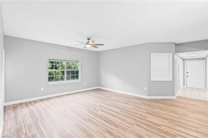 Spare room featuring light wood-type flooring and ceiling fan