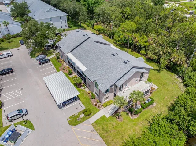 Aerial perspective of suburban area featuring a tree filled landscape