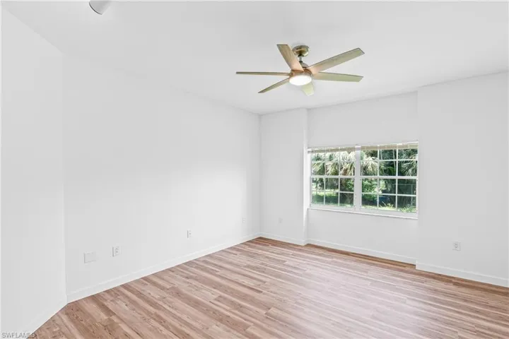 Spare room with light wood-style flooring and ceiling fan