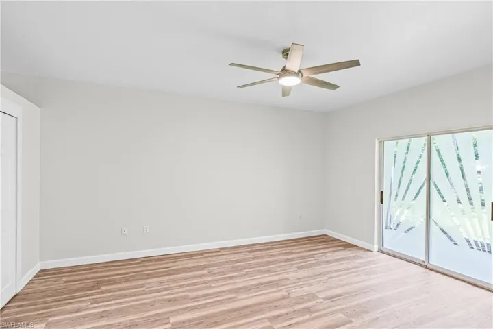 Unfurnished room with light wood-style flooring and ceiling fan