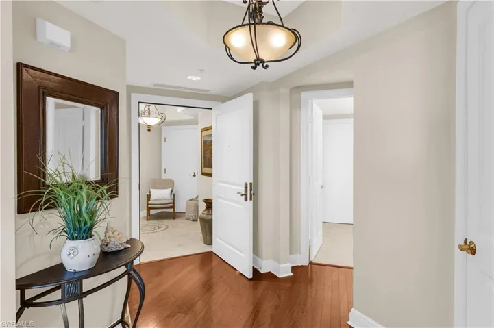 Corridor featuring hardwood / wood-style floors
