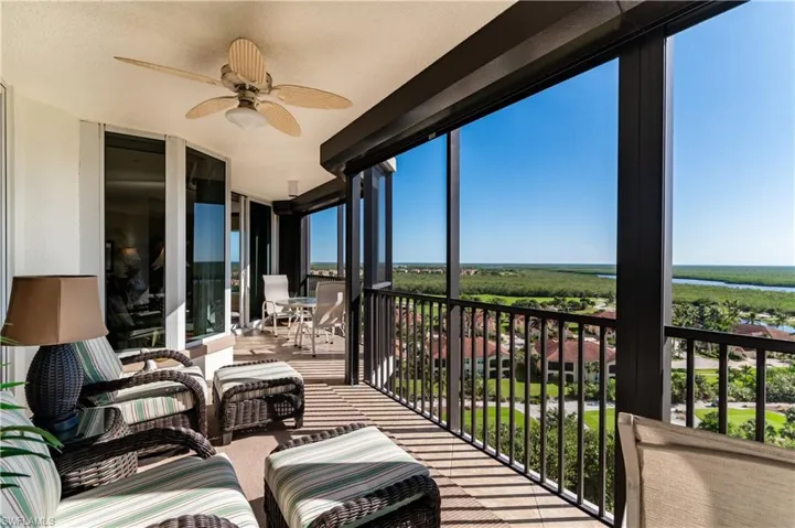 Sunroom / solarium featuring ceiling fan