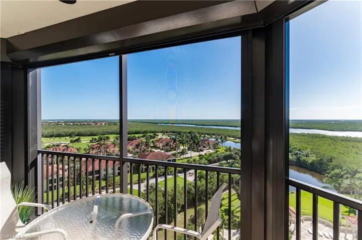 Sunroom with a water view