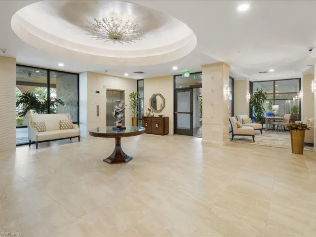 Lobby featuring expansive windows and recessed lighting