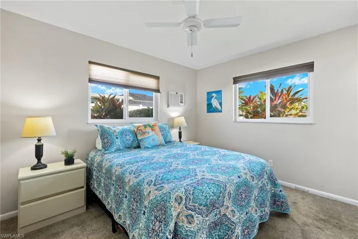 Carpeted bedroom and ceiling fan
