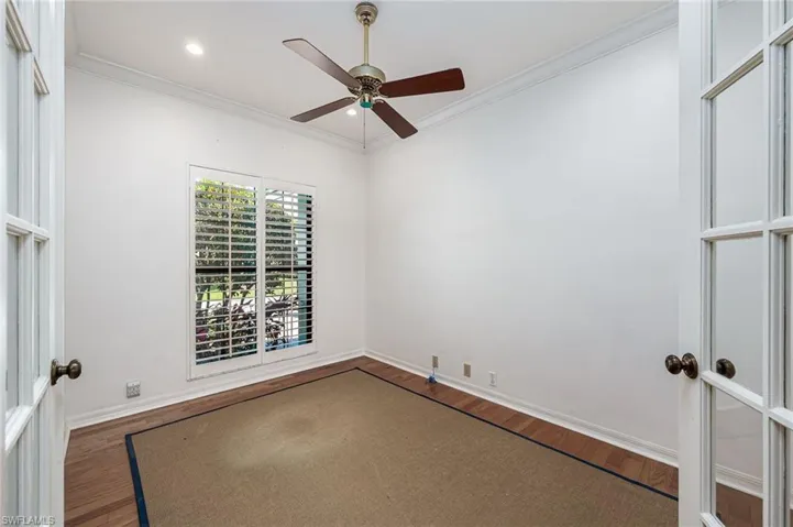 Office or den with french doors off living room