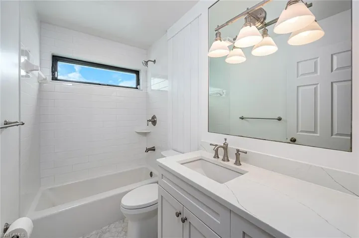 Full 2nd bathroom with vanity, toilet, and tub / shower combination