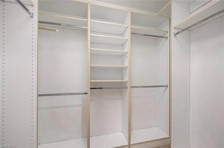 One of two custom closets in the primary bedroom
