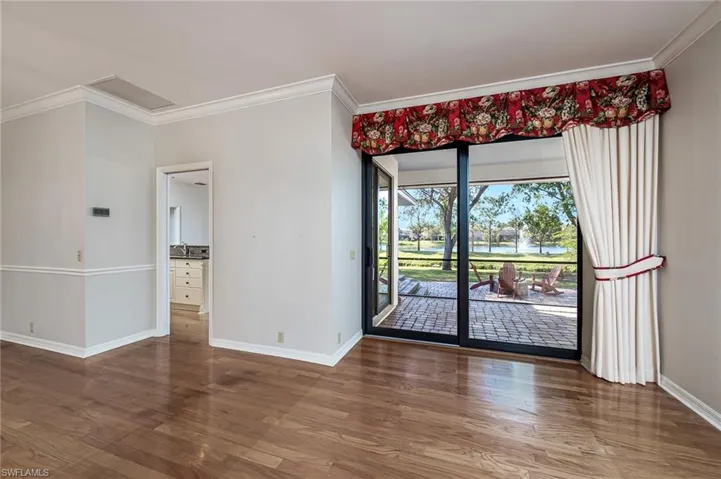 Living room with view of patio and screened lanai