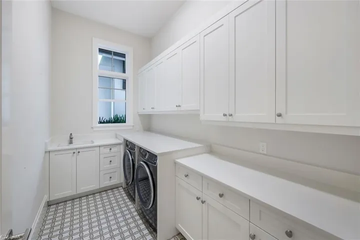 Laundry room featuring cabinet space and washing machine and dryer