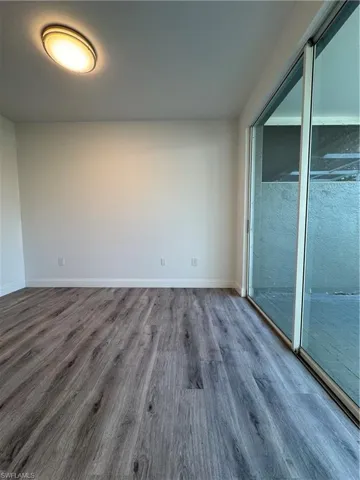 Unfurnished room featuring wood-type flooring