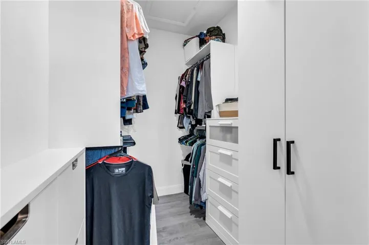 Walk in closet featuring light hardwood / wood-style floors