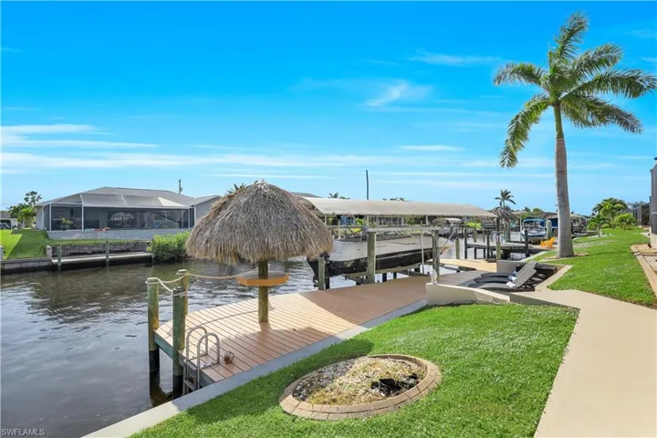 Dock area featuring a yard, a water view,