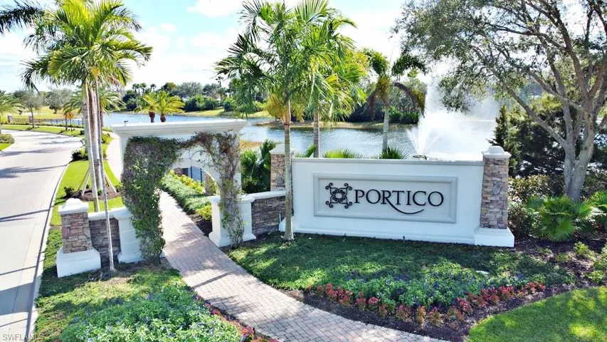 Community / neighborhood sign with a water view