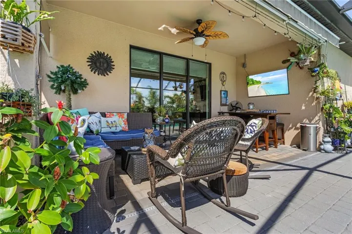 View of patio / terrace with an outdoor hangout area and ceiling fan