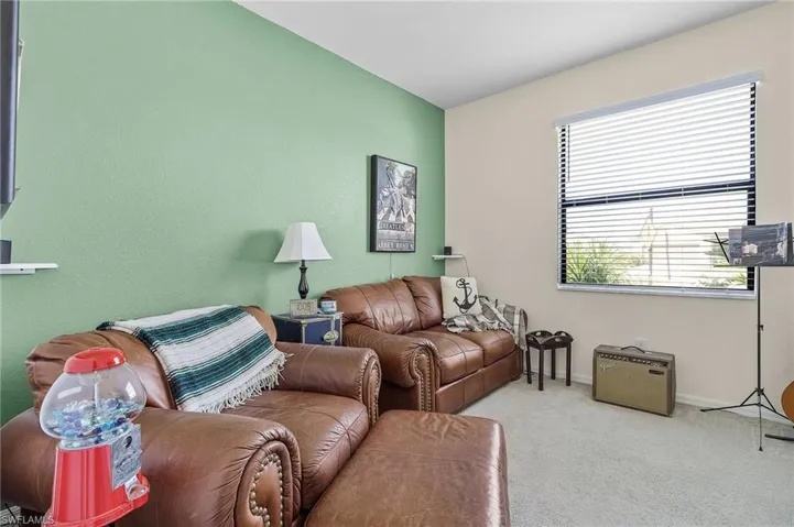 Living room featuring light carpet