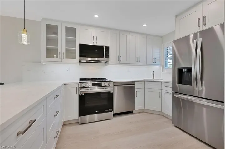 White Kitchen with SS Appliances