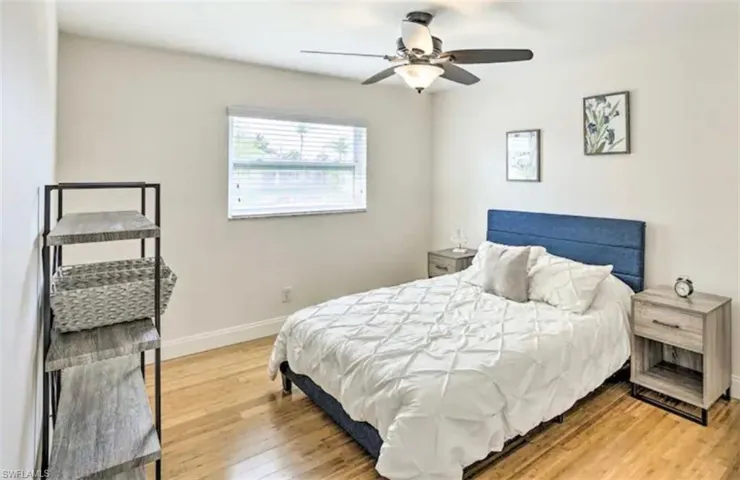 Bedroom featuring light wood-type flooring and ceiling fan