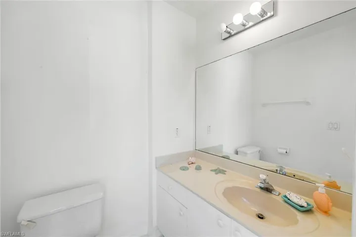 Bathroom with toilet and vanity