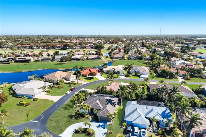 View of property location featuring a large body of water and nearby suburban area