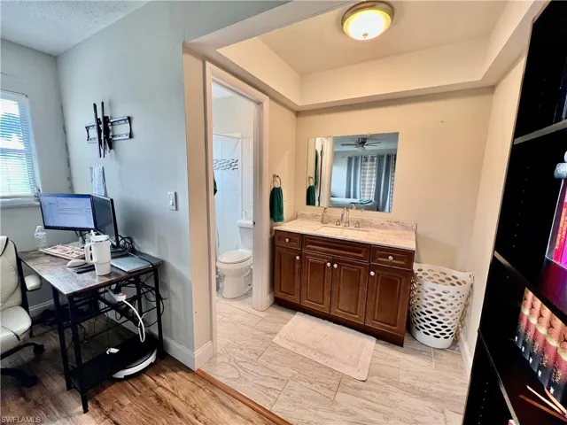 Primary bathroom vanity and dressing area.