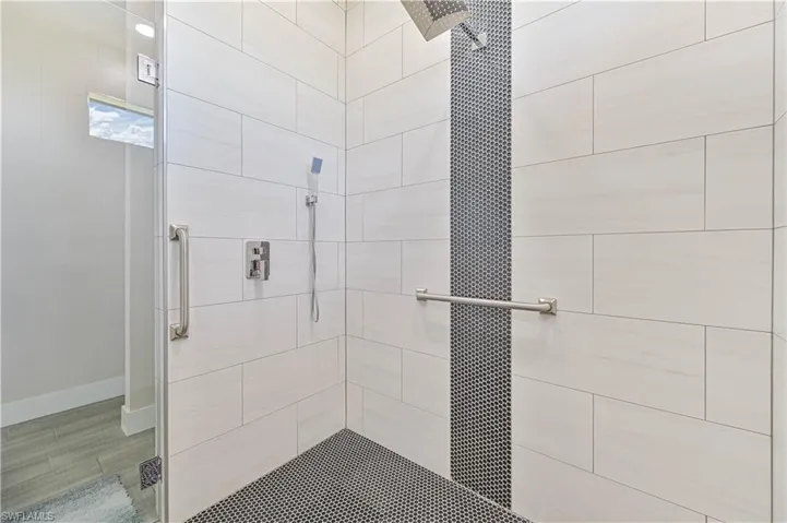 Bathroom featuring walk in shower
