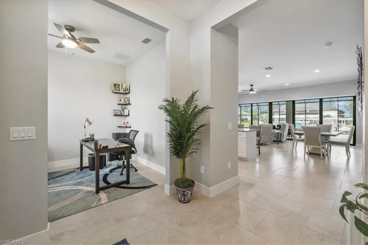 Home office featuring a ceiling fan and recessed lighting