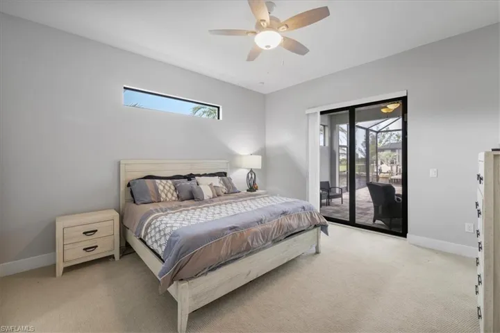 Bedroom featuring carpet floors, access to outside, and a ceiling fan